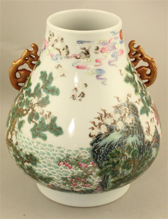 A Chinese famille verte pear shaped vase, Hu, 21cm